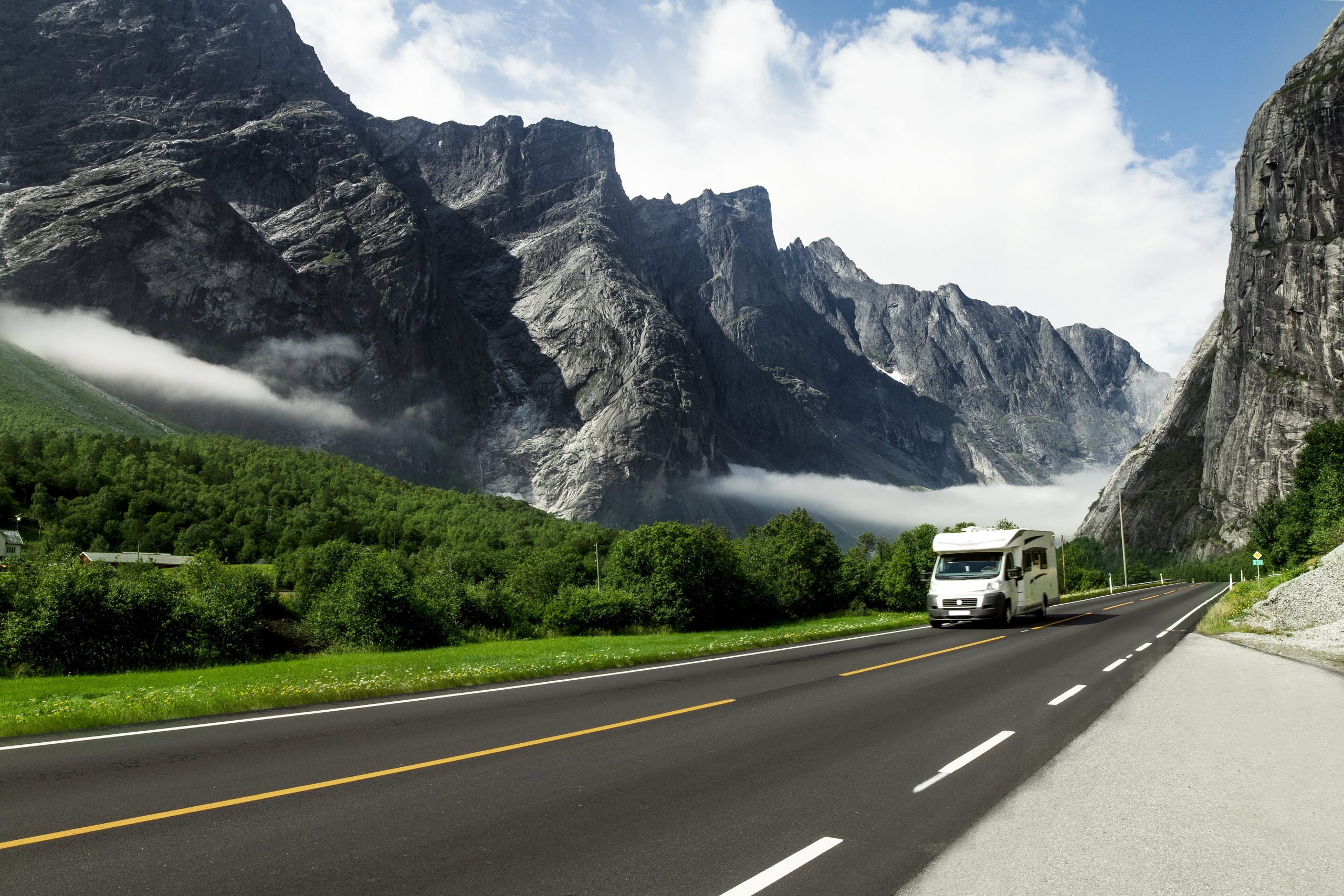 Truck pulling a boat on the road