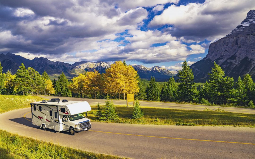 Wide shot of RV on a winding road